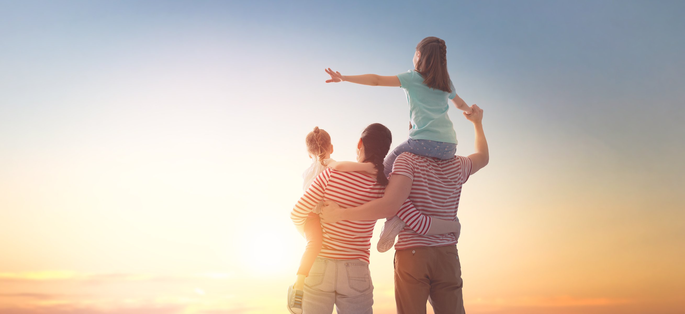 happy family at sunset.